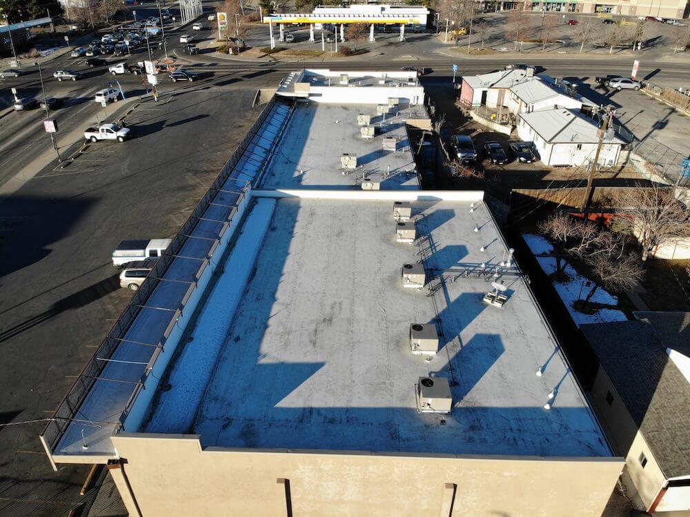 commercial flat membrane roofing project with sealing equipment